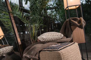 handmade furniture, location with furniture in the botanical garden, knitted furniture, knitted blanket with a pillow