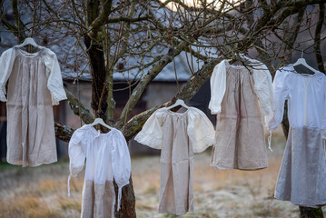 Folk costume in nature. Traditional Slavic suit at a nature exhibition. Detail of clothes,...