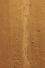 a concrete wall painted orange