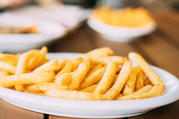 french fries on plate. street food, snacks,