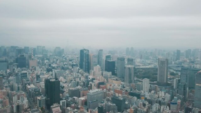 Aerial drone shot of the cityscape of Tokyo, Japan on a cloudy day