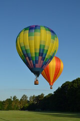 Colorful hot air balloons launching into the sky