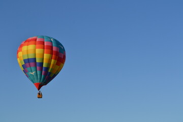 Colorful hot air balloon launching into the sky