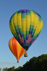 Fototapeta premium Colorful hot air balloons launching into the sky