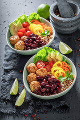 Spicy Mexican salad with vegetables, meatballs and buckwheat groats.