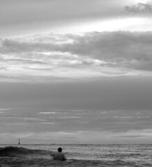 sunset over the sea with high tide in black and white