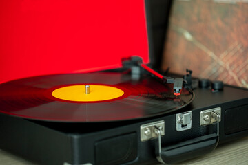 A retro-styled spinning record vinyl player.