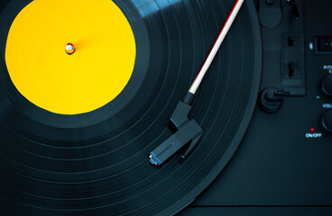 A retro-styled spinning record vinyl player.