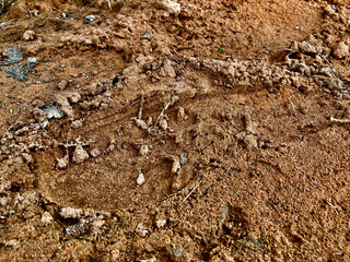 Texture : textile - soil, paving, sand used for building a house in a rural area