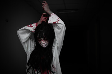 Portrait of asian woman make up ghost,Scary horror scene for background,Halloween festival...