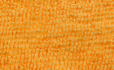 Macro image of a orange and yellow microfiber cloth