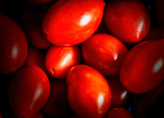 Artistic image of tasty cherry tomatoes photographed in macro.