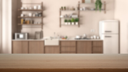 Empty wooden table, desk or shelf with blurred view of modern kitchen close up, cabinets and shelves, refrigerator and appliances, modern interior design concept