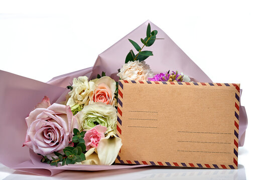 Postcard with a bouquet of flowers for greeting and a postal envelope , over white background.