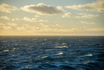 Obraz premium Beautiful seascape - waves and sky with clouds with beautiful lighting. Golden hour.