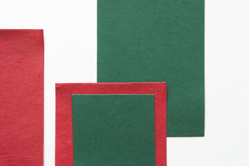 green and red paper on a white background