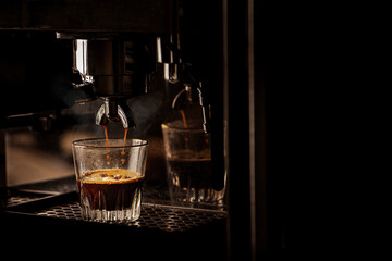 Espresso coffee brewing by machine.