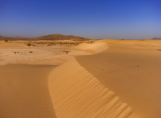 Fototapeta na wymiar Sand Dune Abstract view of the Parque Natural Corralejo Fuerteventura