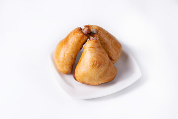 samsa in a white plate on a white background