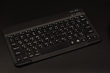 Thai typing keyboard, black on the table