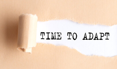 The text TIME TO ADAPT appears on torn paper on white background.