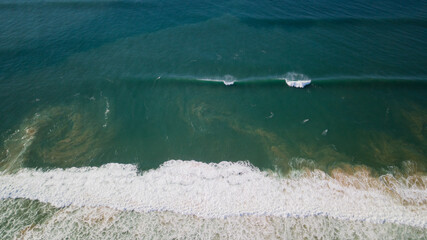 Aerial view of Turquoise blue wave breaking