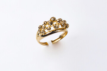 female gold ring on white background