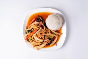 boiled rice with fried vegetables and chicken meat. on a white background