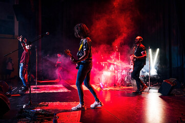 Rock and roll group performing live.