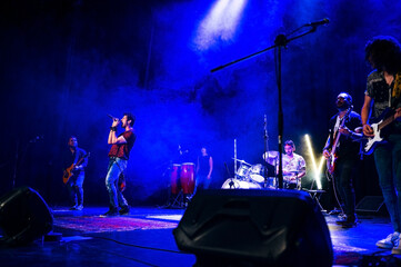 Rock and roll group performing live.