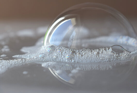 a beautiful soap bubble around the soap foam. beautiful background