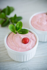 sweet curd mass whipped with fresh strawberries in a bowl