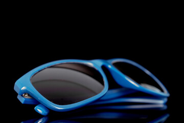 One sunglasses, close-up, isolated on a white background.