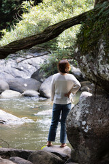 People are in the forest watching waterfalls and watching the beautiful nature playing in the water and relaxing on vacation. At Khao Yai National Park, Thailand, 16-05-2022
