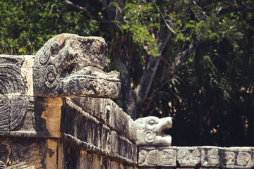 chichen itza maya ruin calendar in Mexico, historic unesco site detail of stone carved religious sculpture