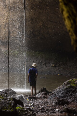 Obraz premium People are in the forest watching waterfalls and watching the beautiful nature playing in the water and relaxing on vacation. At Khao Yai National Park, Thailand, 16-05-2022