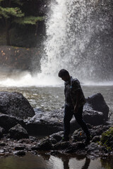 Obraz premium People are in the forest watching waterfalls and watching the beautiful nature playing in the water and relaxing on vacation. At Khao Yai National Park, Thailand, 16-05-2022