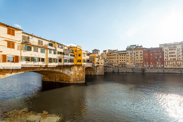 Sunset view on famous Old bridge called Ponte Vecchio on Arno river in Florence, Italy. Concept of...