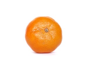 A ripe tangerine isolated on a white background.