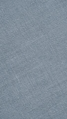 Fototapeta na wymiar Light blue woven surface closeup. Linen textile texture. Fabric net vertical background. Textured braided len backdrop. Mobile phone wallpaper. Macro