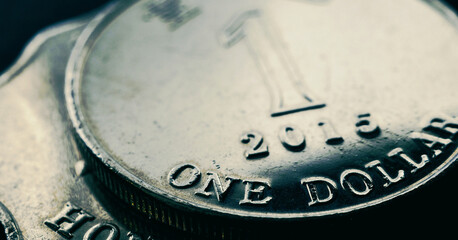 1 one Hong Kong dollar. Fragment of textured coin. Dark tinted horizontal stories on the theme of economics or banking. Coins and money of Hong Kong. News about the exchange rate or inflation. Macro