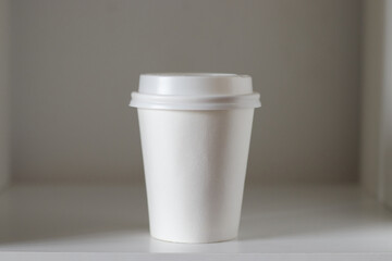 coffee cup on the shelf, mockup, own design,, close-up