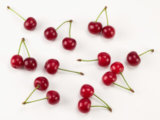 Fresh red sour cherries isolated on white background. Top view. Flat lay pattern.