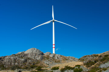 Fototapeta na wymiar Onshore Windmill in the hills of Norway- a global leader in clean energy adoption