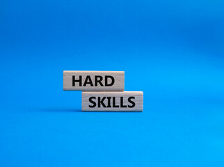 Hard skills symbol. Wooden blocks with words Hard skills. Beautiful blue background. Business and Hard skills concept. Copy space.