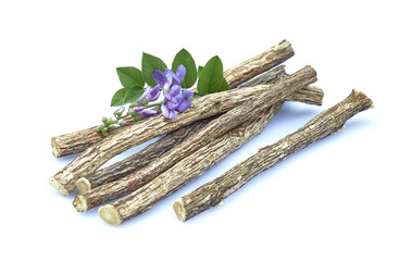 Licorice dry roots with flowers on white background