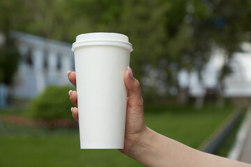 paper coffee cup on the table, mockup, custom design, close-up