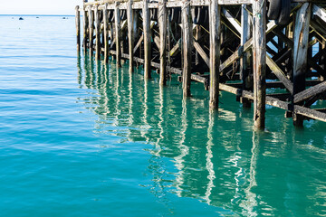 Structure patterns and reflections under historic Jackson Bay pier