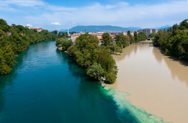 Famous La Jonction, the joint and confluence of  rivers Rhone on the left and Arve on the right in...