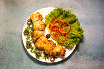 chicken Reshmi tikka boti kabab platter with salad in a dish top view of middle eastern barbeque...